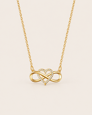 Gold-tone infinity heart necklace with sparkling stones