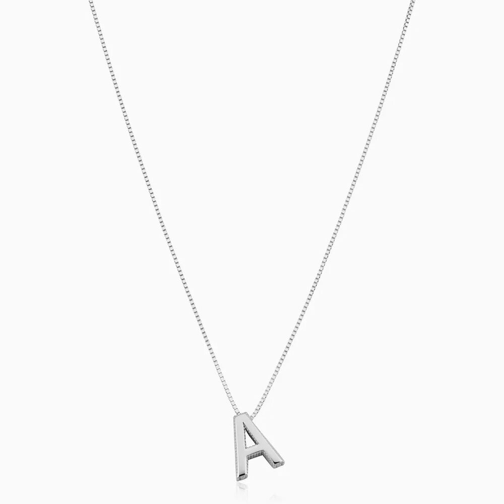 Silver initial letter necklace on a white background