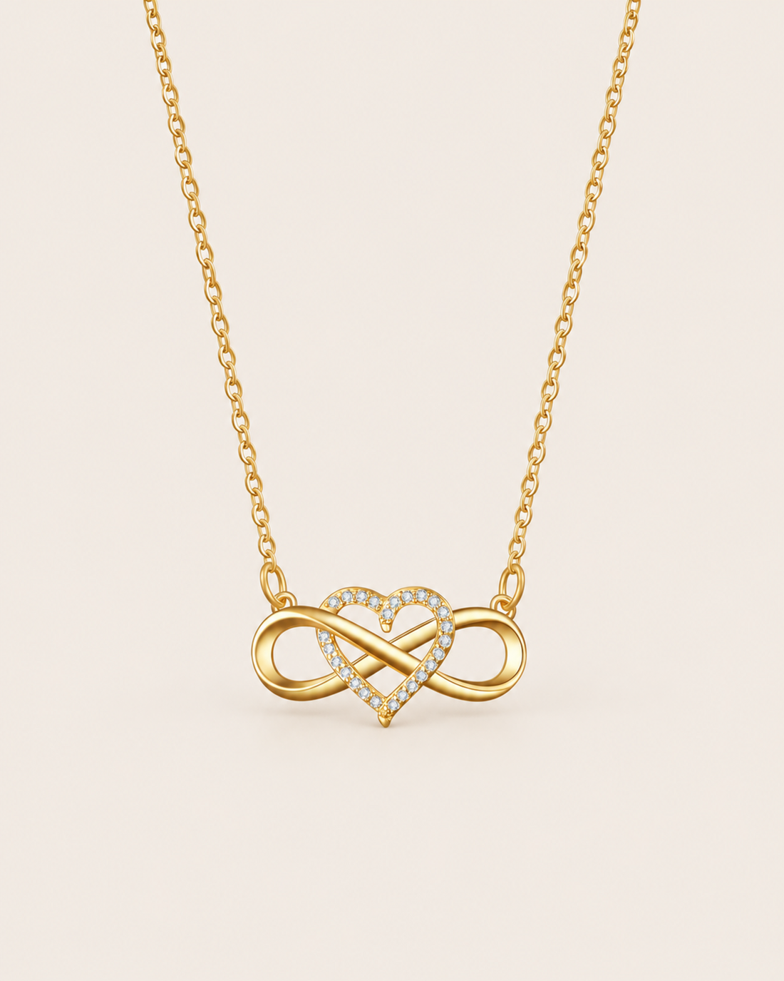 Gold-tone infinity heart necklace with sparkling stones
