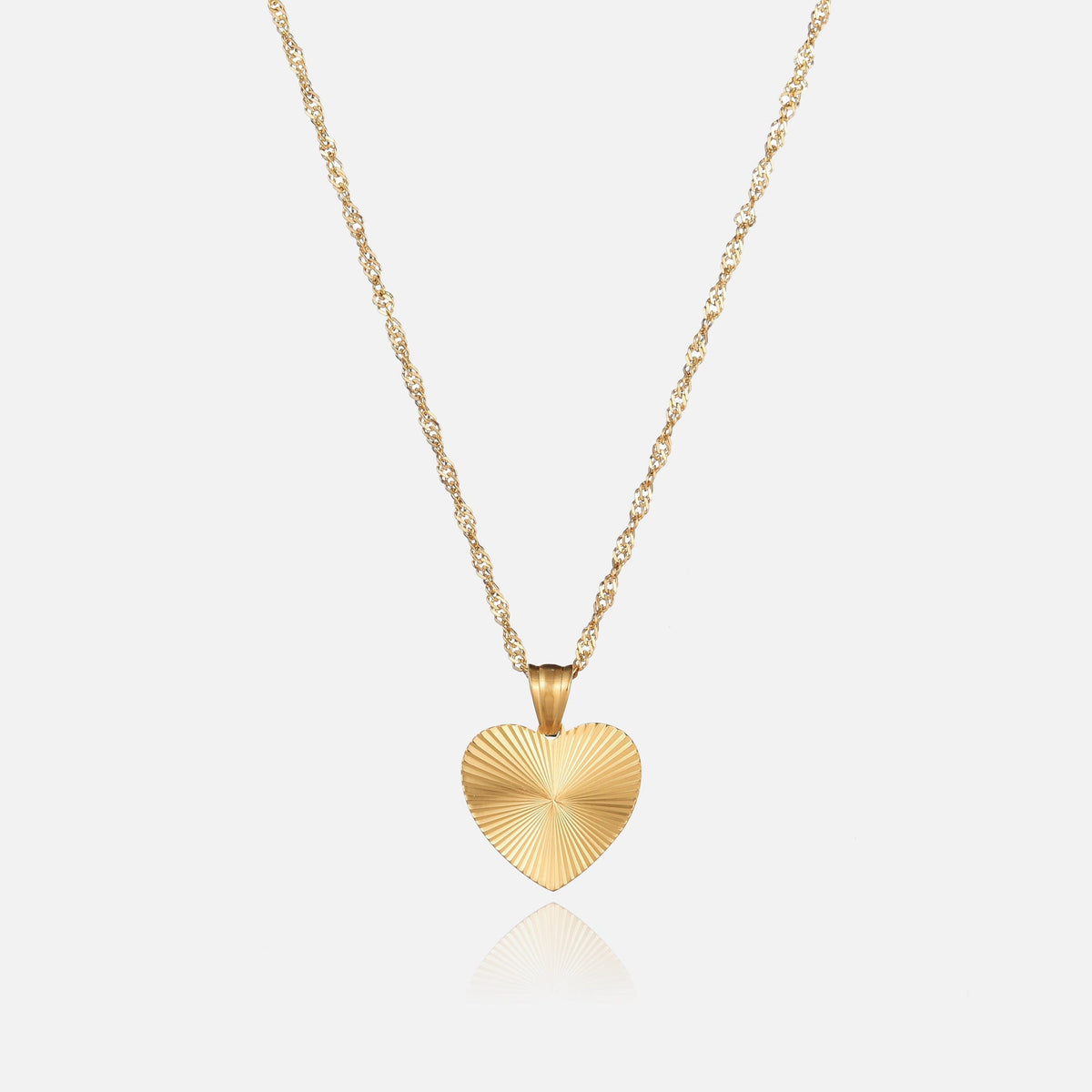 Gold heart necklace on a twisted rope chain