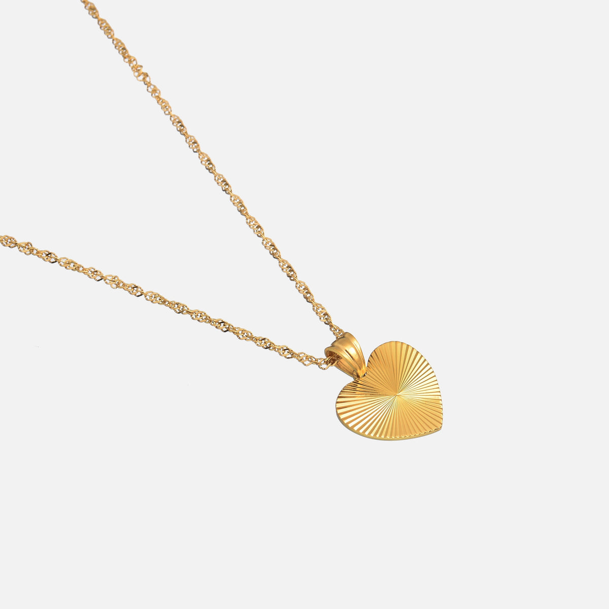 Close-up of the ridged gold heart pendant