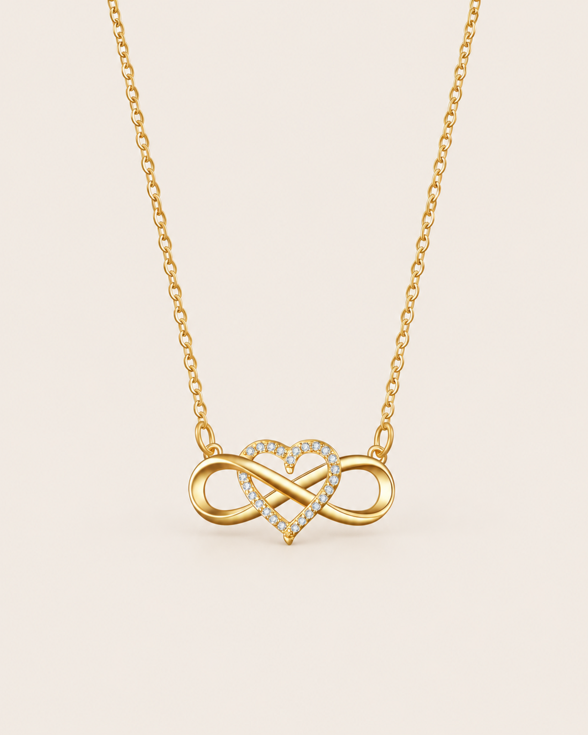 Gold infinity heart necklace with sparkling stones