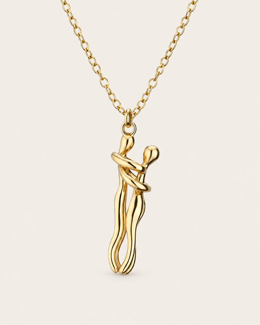 Gold hugging couple necklace with embrace pendant