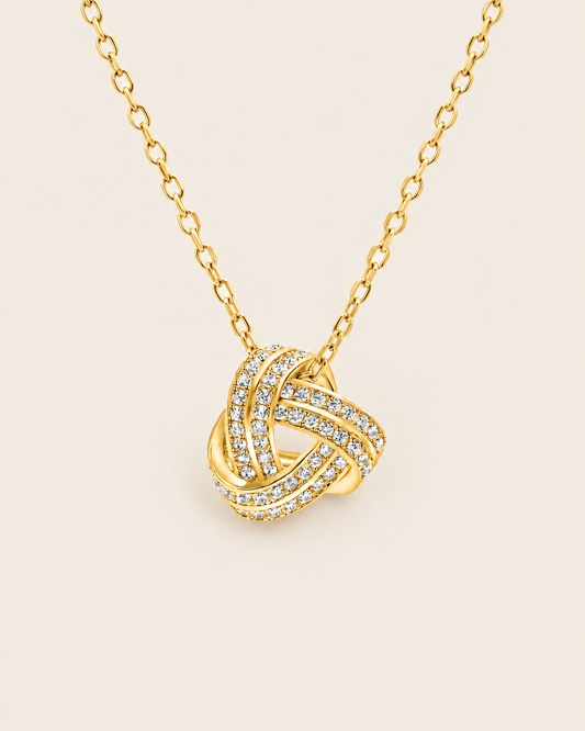 Gold love knot necklace with sparkling stones