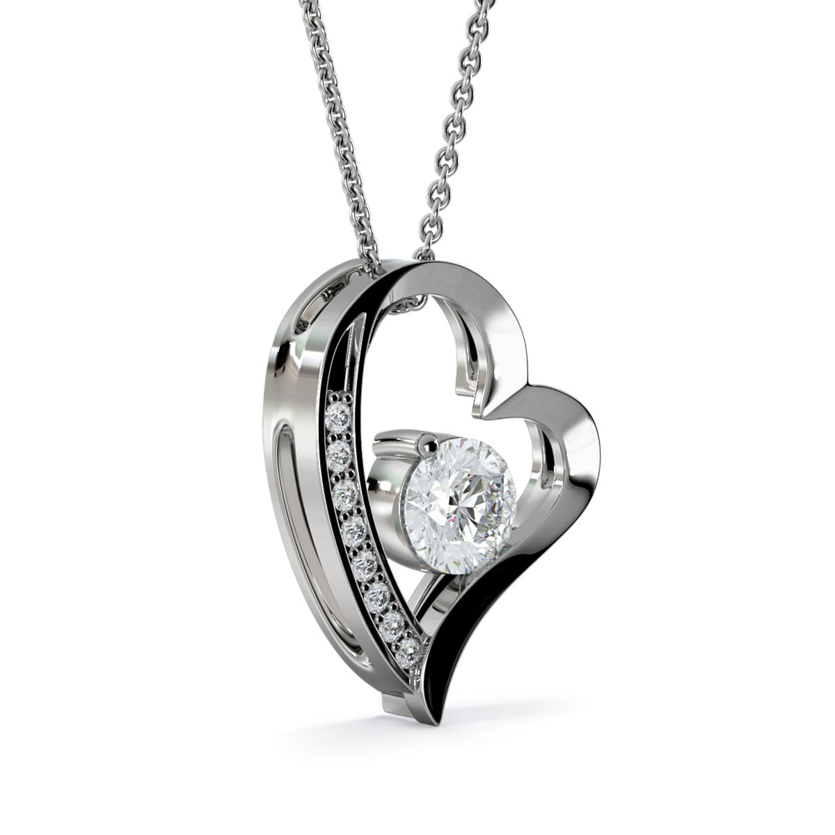 Close-up of the silver heart pendant with a row of small stones